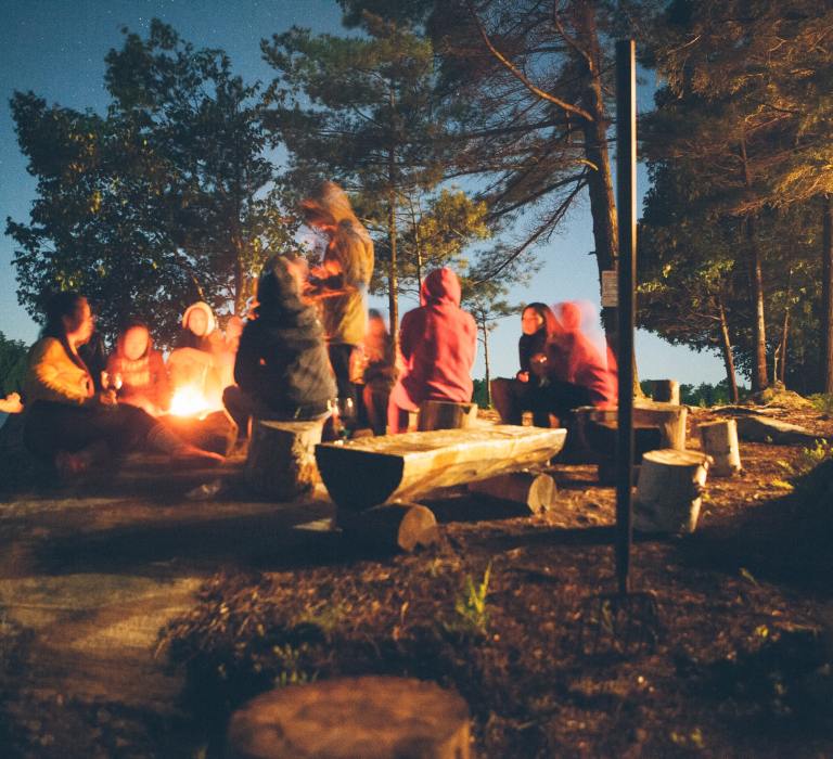 Group of campers enjoying food together