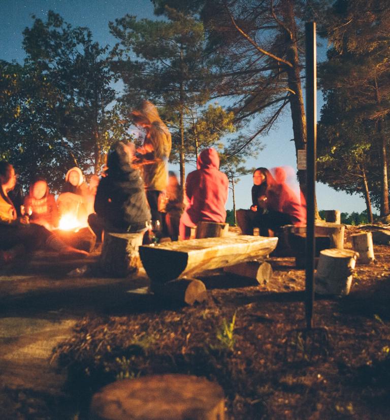 Group of campers enjoying food together